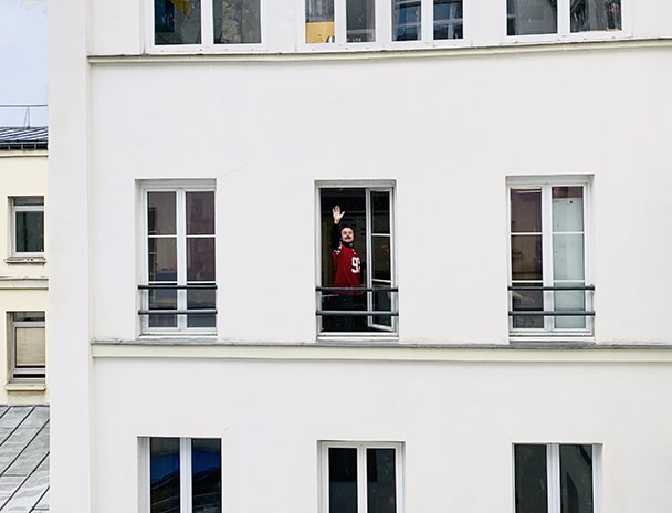 Person waving through the window