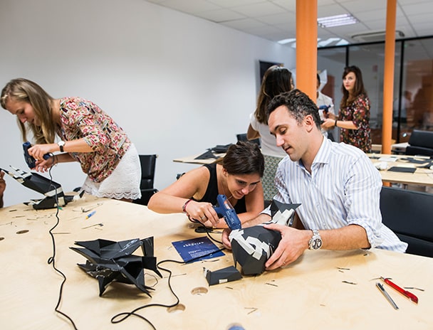 3 people working on their prototypes for the Deplastify the Planet Programme